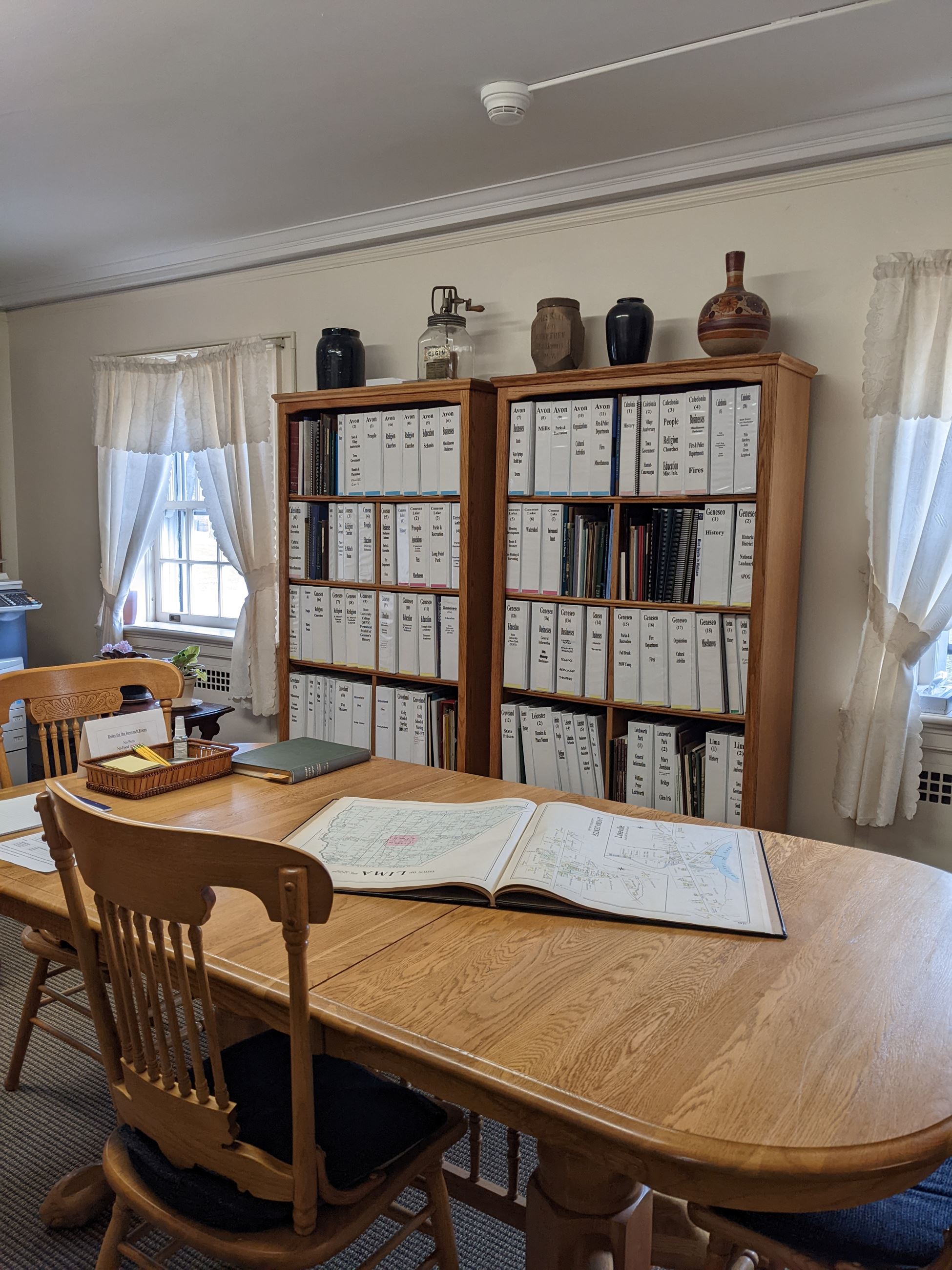 Image of research room, with map on table and sun coming in window